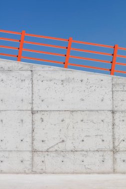 Minimalist Concrete Wall with Clear Blue Sky