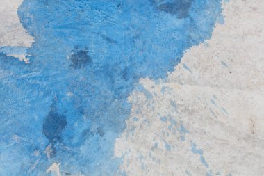 Blue Paint Stains on Concrete Surface