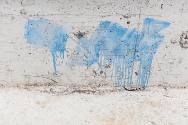 Blue Paint Stains on Concrete Surface