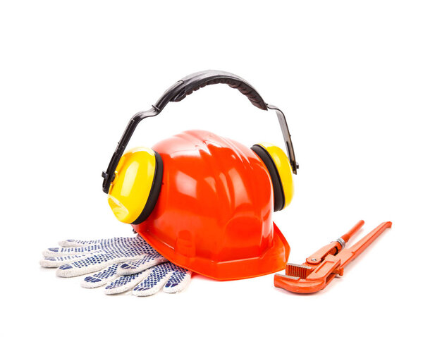 Close-up of set of protective items and tools for workers. It is isolated in a white background.
