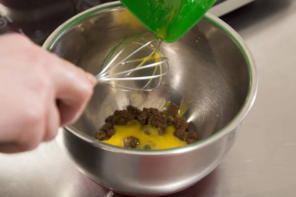 A pile of brown sugar and yolk in steel bowl. — Stock Photo, Image