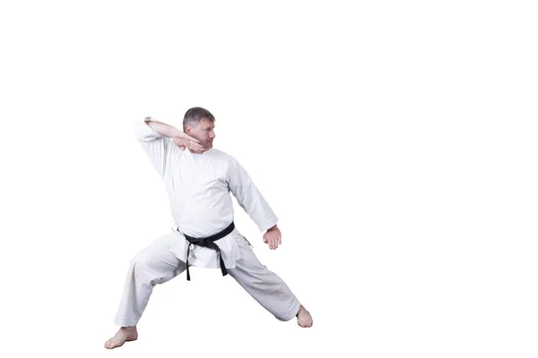 Adult athlete performs formal goju-ryu exercises. — Stock Photo, Image