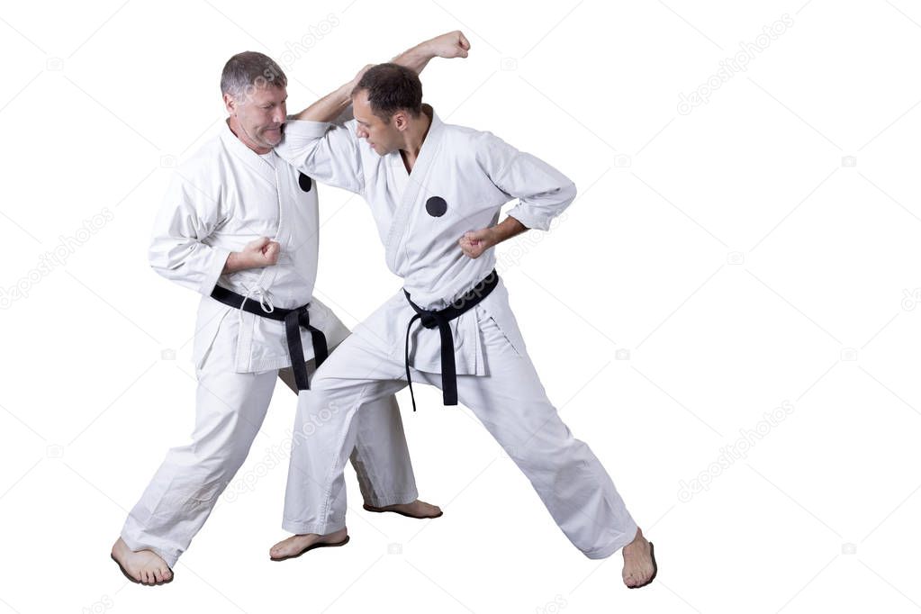 Adult athlete performs formal goju-ryu exercises.