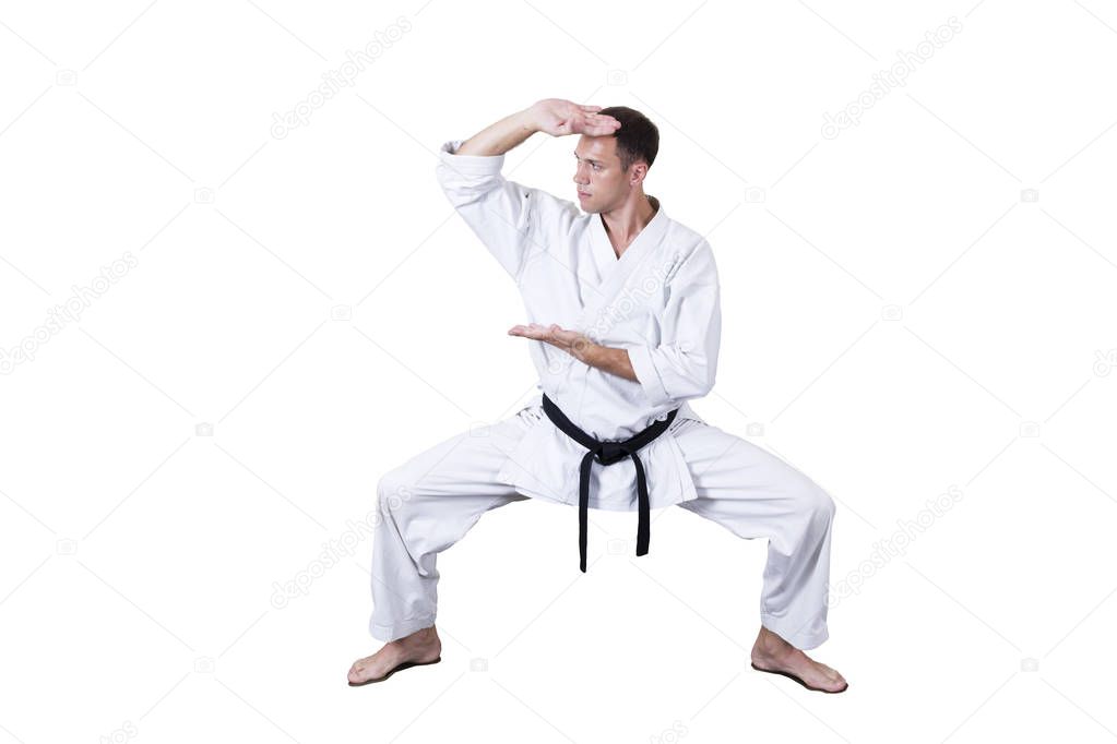 Adult athlete performs formal goju-ryu exercises.