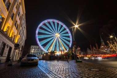 Lubeck, Germany - December 25, 2017: Lubeck Ferris Wheel. Long exposure shot. Christmas time.