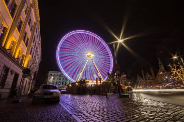 Lubeck, Germany - December 25, 2017: Lubeck Ferris Wheel. Long exposure shot. Christmas time.