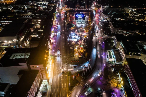 Aerial view of Hamburg at night, Germany. Christmas time. Wandsbek station. City traffic. Christmas decorations. Aerial footage. Night.
