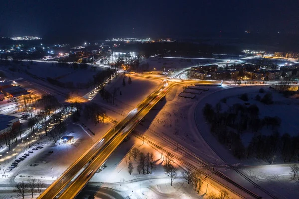 Aerial view of city at winter night. Amazing winter landscape.