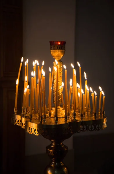 Burning Yellow Candles Church Standing Pedestal — Stock Photo, Image