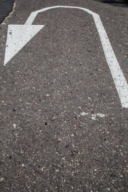 Road marking on asphalt. Painted signs on the roadway for drivers of various vehicles. Dotted line and arrows. Belarus clipart