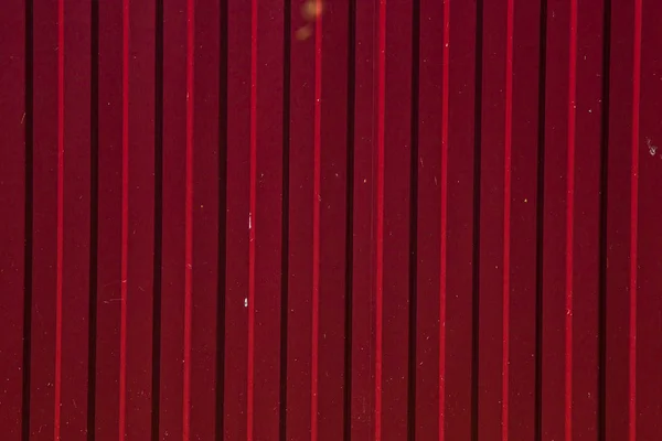 red textured metal fence.  background from metal There\'s more detail, more texture.  ,  .