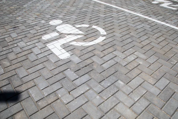 Road marking on asphalt. Painted signs on the roadway for drivers of various vehicles. Dotted line and arrows. Belarus