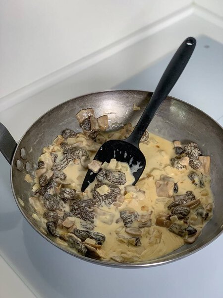 morels in a creamy sauce, in a pan