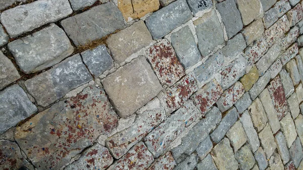 Granite cobblestoned pavement background. Stone pavement texture