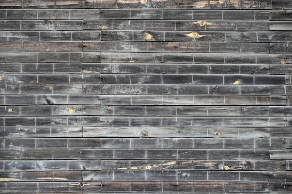 Background of old rotten boards nailed to one sheet.