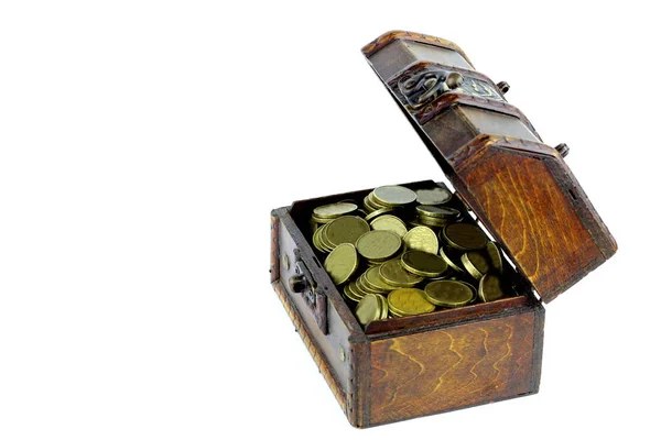 A small chest of wood with coins on a light background.