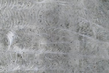 Arka plan doğal griden yapılmış cilalı beton bir duvar şeklinde.,
