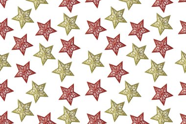 Beyaz arka planda desenleri olan altın ve kırmızı yıldızların Noel deseni .