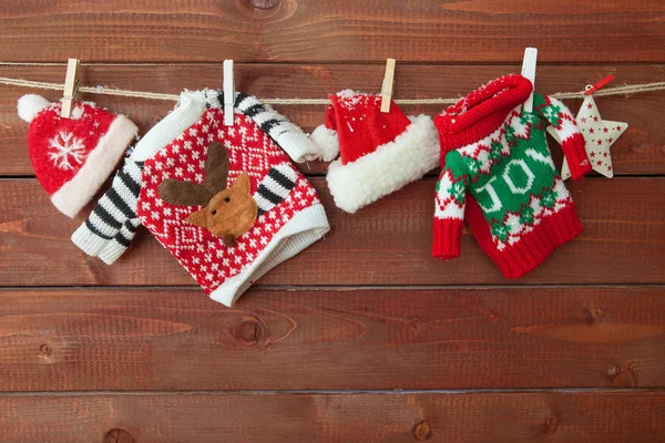 Little Knitted Christmas Pullovers Wooden Background — Stock Photo, Image