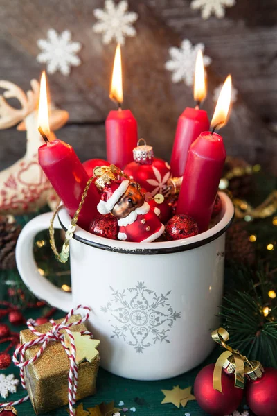 Rustic mug with colorful festive decorations for a merry christmas
