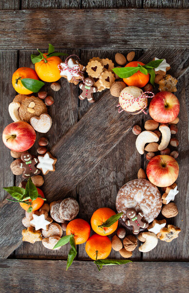 Gingerbread, nuts and fruits for a Merry Christmas /  Happy Holidays