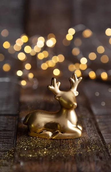 Golden ornament in front of bokeh lights — Stock Photo, Image