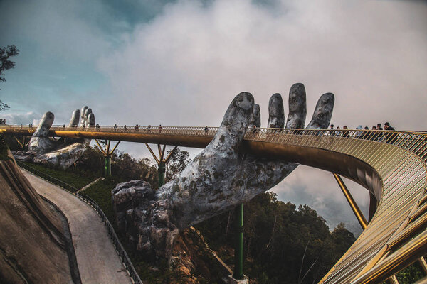 Golden bridge in Bana Hills French village, Sun World, Da Nang, Central Vietnam