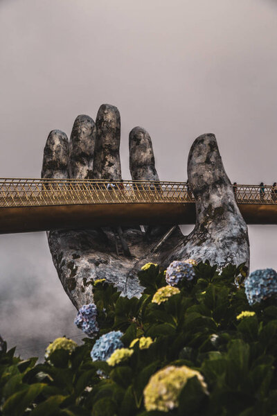 Golden bridge in Bana Hills French village, Sun World, Da Nang, Central Vietnam