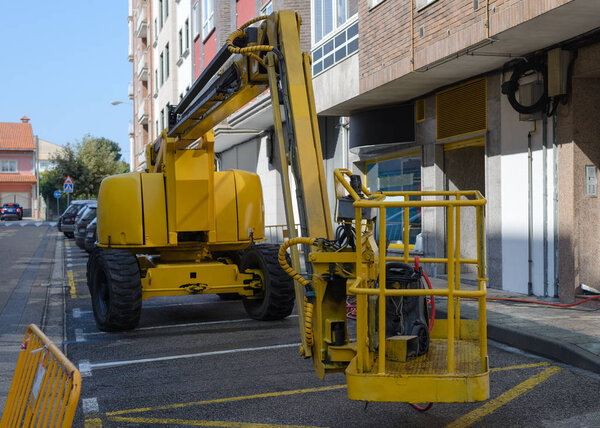 construction lift on the street near the house
