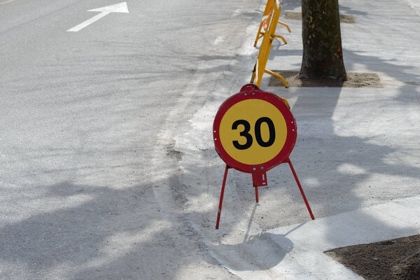 traffic sign 30 km speed limit on the road