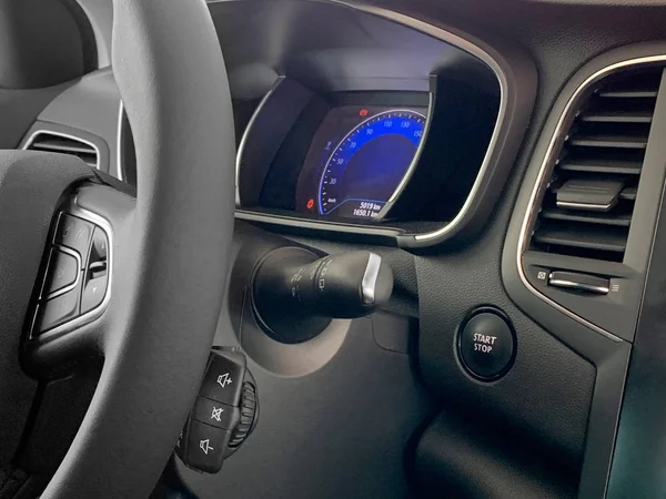 Part of the car steering wheel with shift paddles and dashboard — Stock Photo, Image