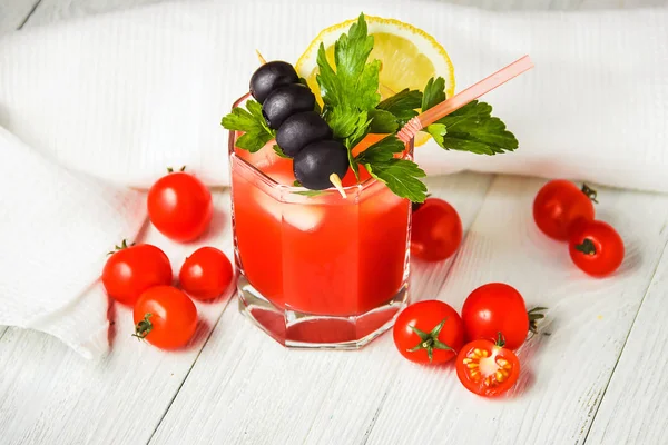 Cocktail Bloody Mary with ice in glasses on white wooden table. — Stock Photo, Image