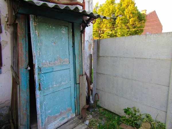 old broken wooden door in the yard. photo