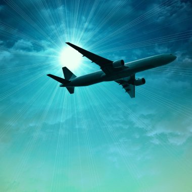 karanlık gökte uçan uçak silueti 