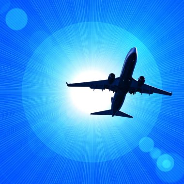 karanlık gökte uçan uçak silueti 