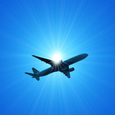 karanlık gökte uçan uçak silueti 