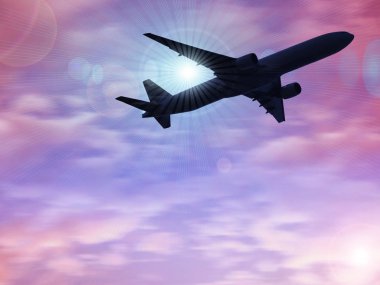 karanlık gökte uçan uçak silueti 