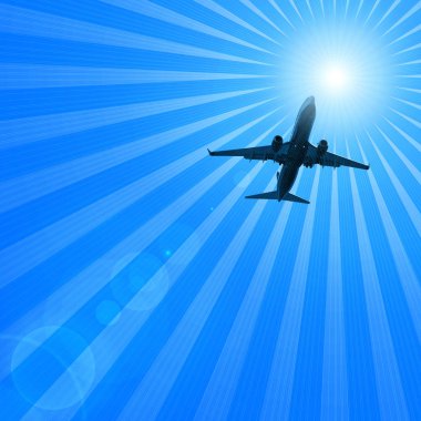 karanlık gökte uçan uçak silueti 