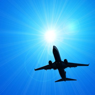 karanlık gökte uçan uçak silueti 