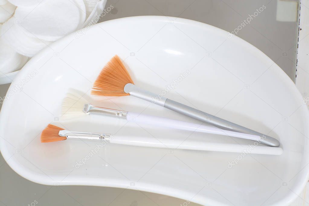 Close-up view of the cosmetic brushes for peeling and facial cleansing.