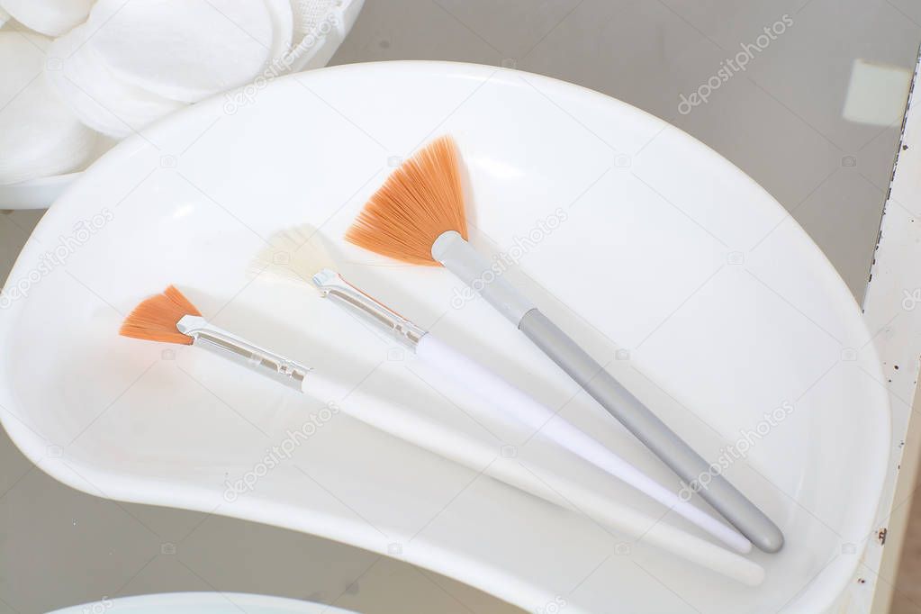 Close-up view of the cosmetic brushes for peeling and facial cleansing.