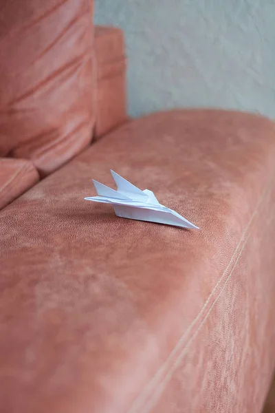 Paper plane model. Origami. Handmade paper plane. Travel concept.