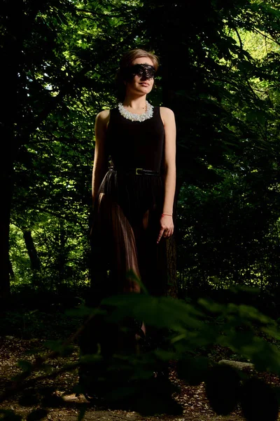 Young attractive woman is wearing the sexy transparent black dress. Young woman modern portrait. — Stock Photo, Image