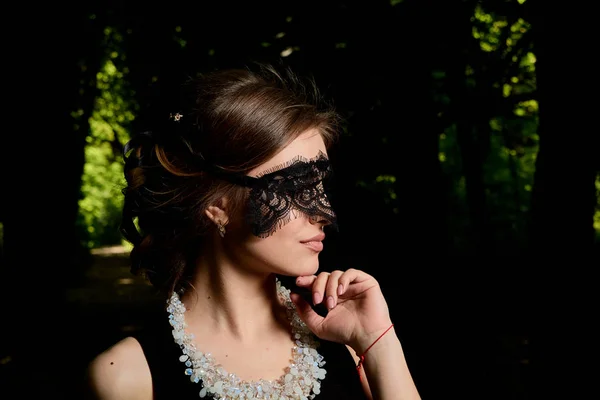 Young attractive woman is wearing the sexy transparent black dress. Young woman modern portrait. — Stock Photo, Image