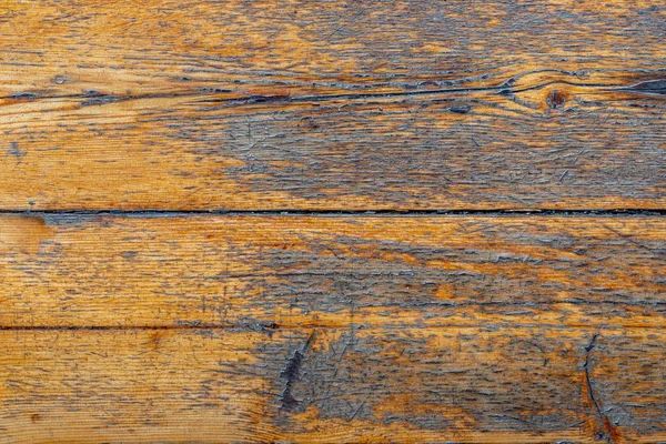 La superficie de las viejas tablas de madera con barniz agrietado. Fondo de viejas tablas de mala calidad — Foto de Stock