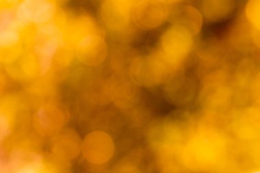 Sarı-kahverengi tonlarda çözünmüş soyut arkaplan. Harfler ve tasarım için boşluk