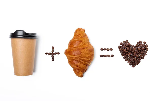 Hjärtat av kaffe bönor med papper kaffekopp och croissant är — Stockfoto