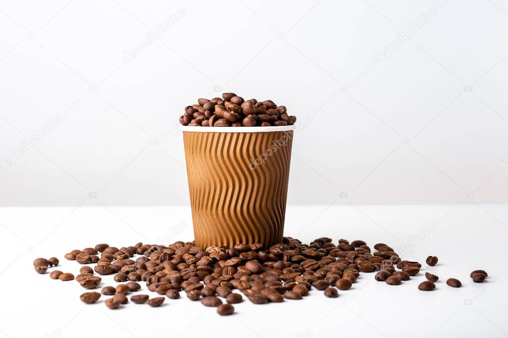 Craft coffee cup full of coffee bean on white background