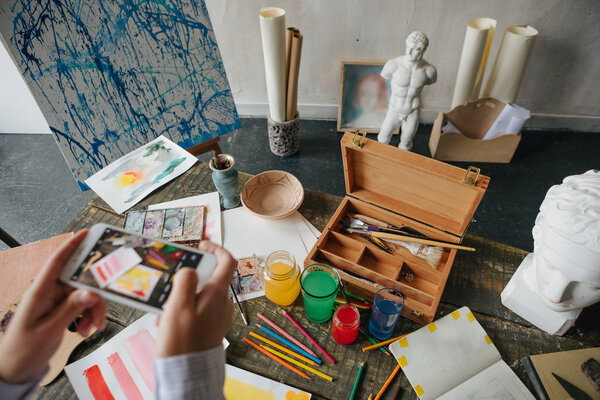 Art work and cell phone photography. Creative work process. Cell phone photos for online blog