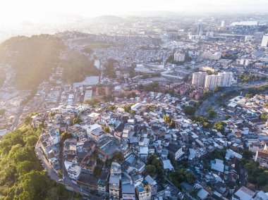favelas house on the hills. Aerial photo of city Rio de Janeiro Brazil. narrow streets of the poor . Beautiful sunset backlight